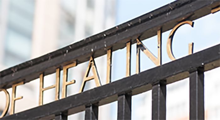 Campus gate with the word "Healing"