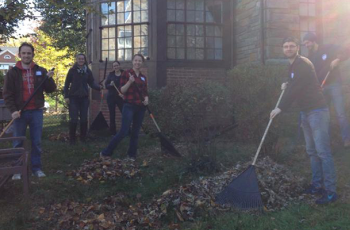PA students raking leaves outside